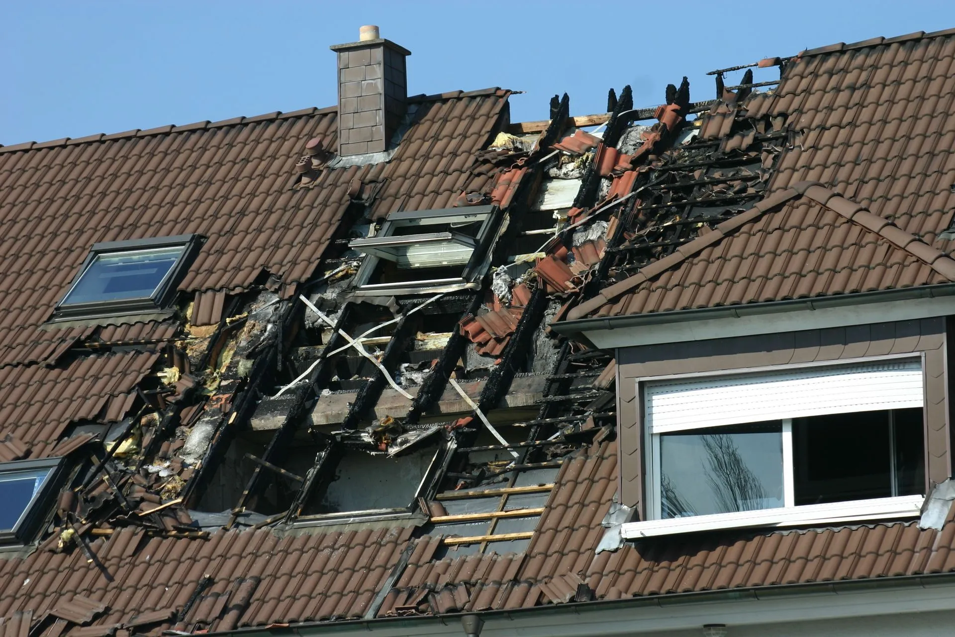 Severely damaged roof after fire