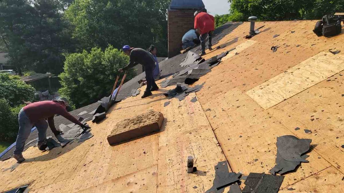 Roof decking exposed during asphalt shingle removal